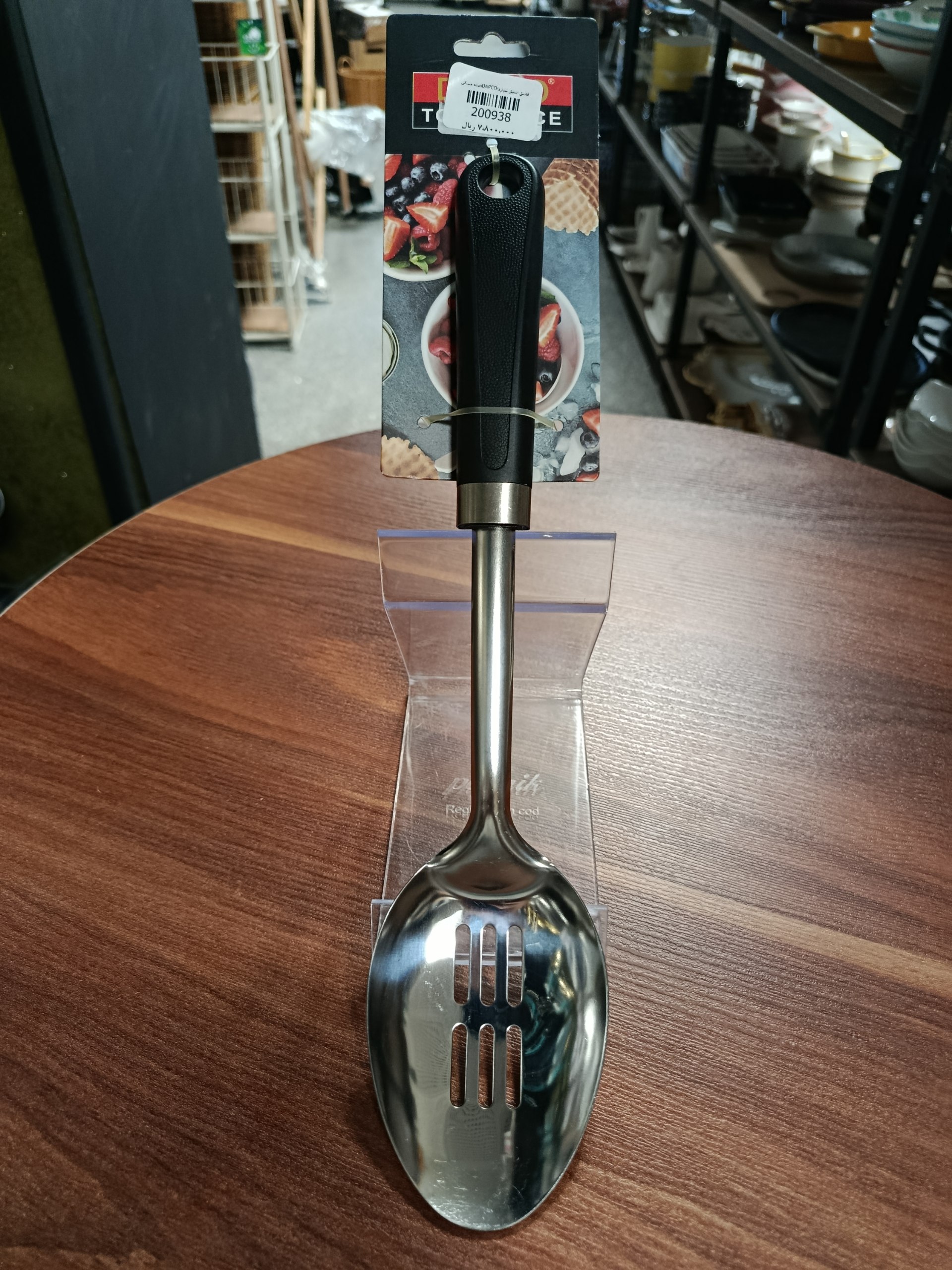 قاشق استیل شیاردار دسته مشکی Grooved steel spoon with black handle